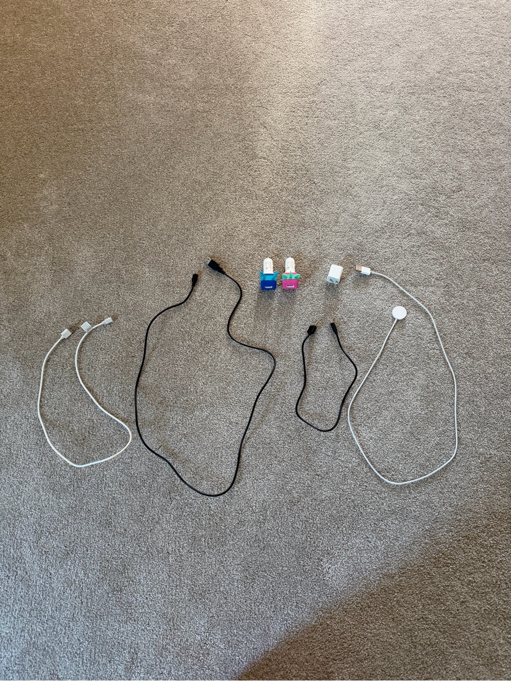 Assorted Charging Cables and USB Adapters - White, Black, Blue, Pink
